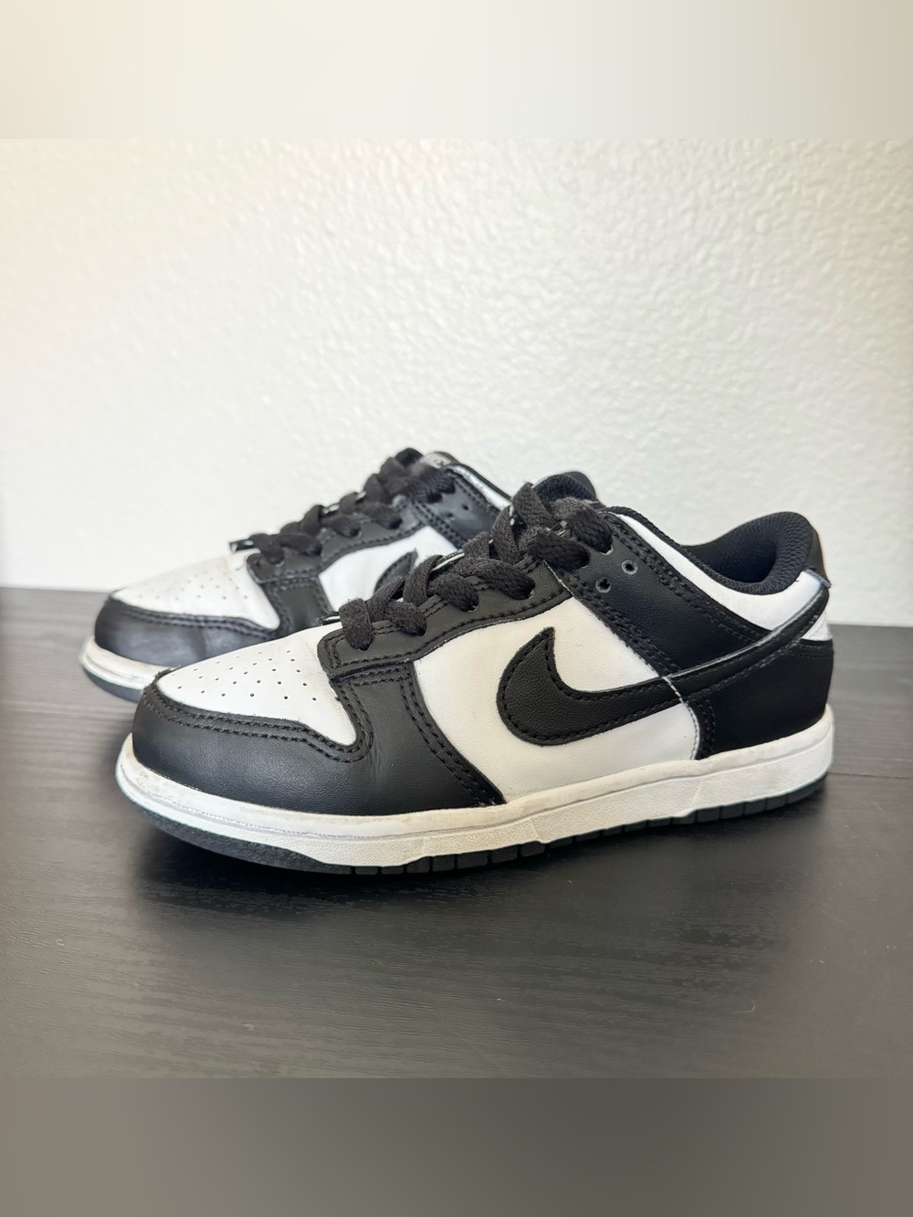 Children’s Nike Dunk Low black and white tennis shoes